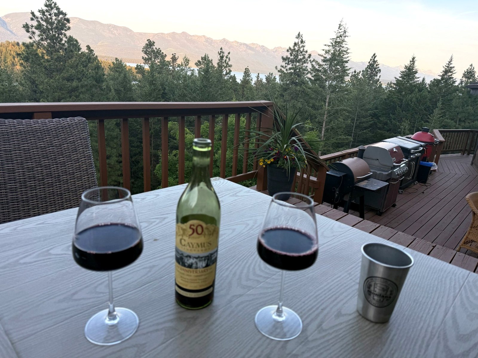 Outdoor deck seating for 20+ guests at Eagle's Bluff — al fresco dining on Flathead Lake