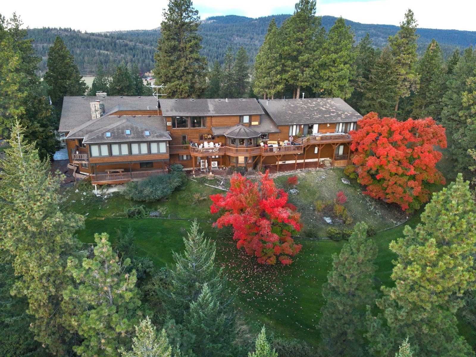 Aerial back view of Eagle's Bluff Main House with Flathead Lake panorama