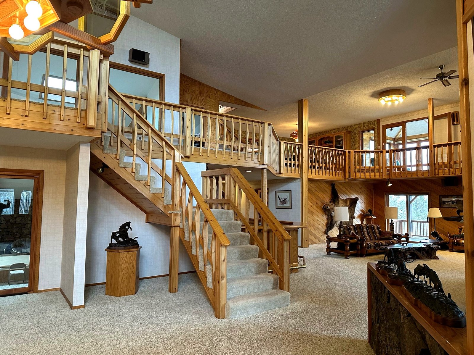 Custom staircase with handcrafted details in Eagle's Bluff Main House entrance