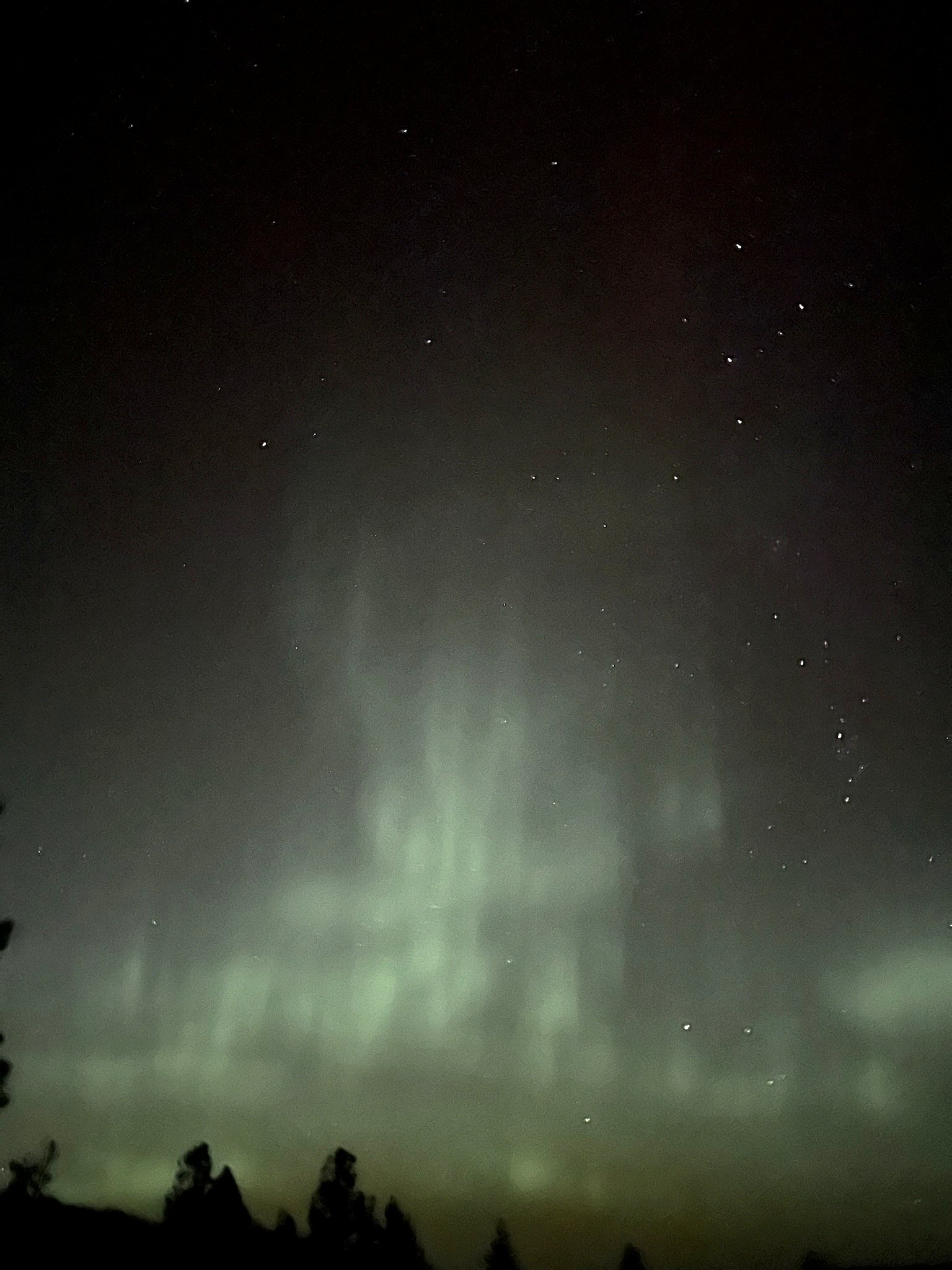 Northern lights (aurora borealis) over Eagle's Bluff estate on Flathead Lake
