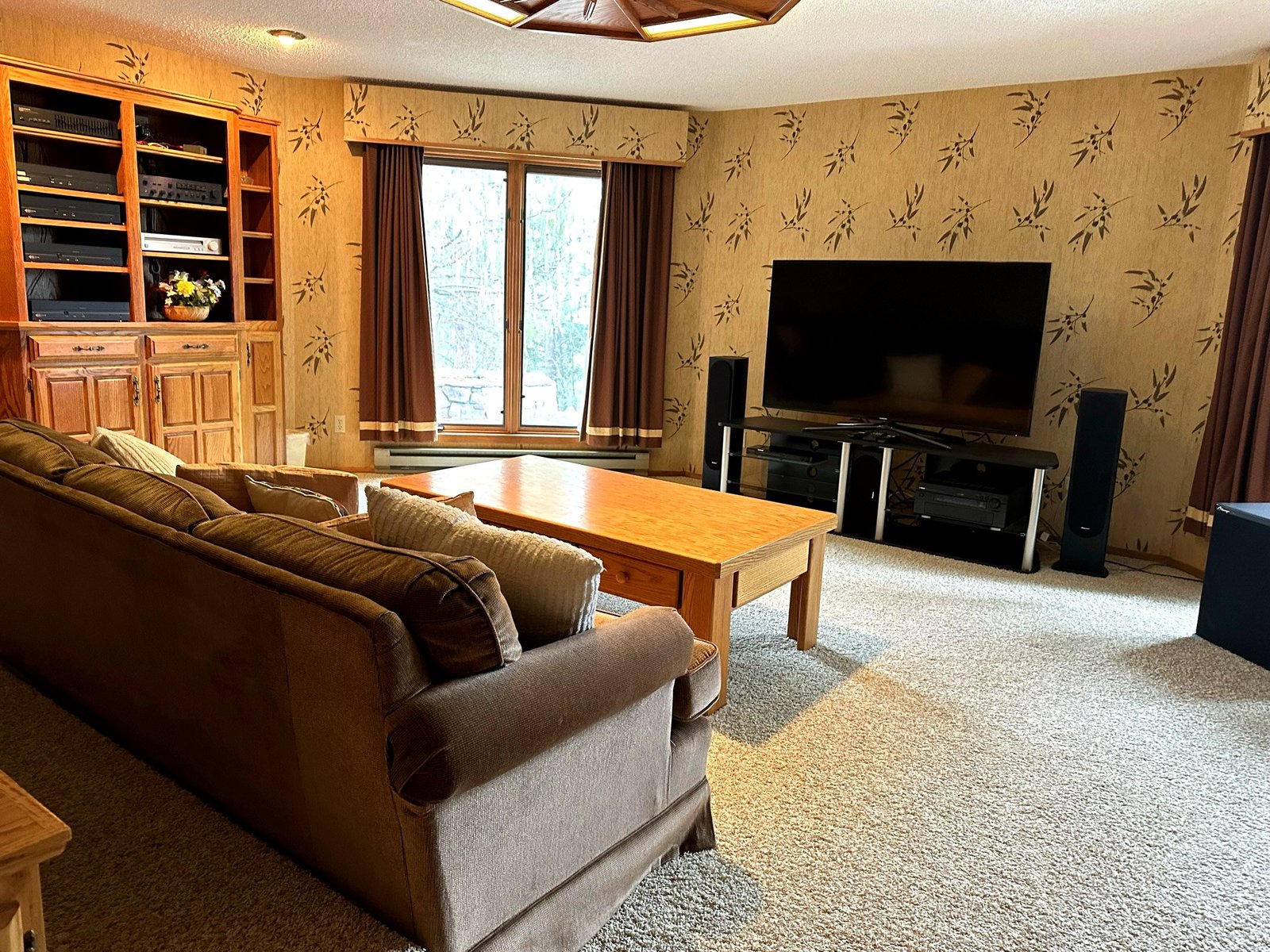 Home theatre with stadium seating at Eagle's Bluff luxury estate on Flathead Lake