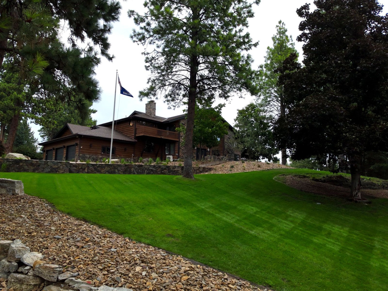 Aerial view of Eagle's Bluff private peninsula surrounded by crystal-clear Flathead Lake waters