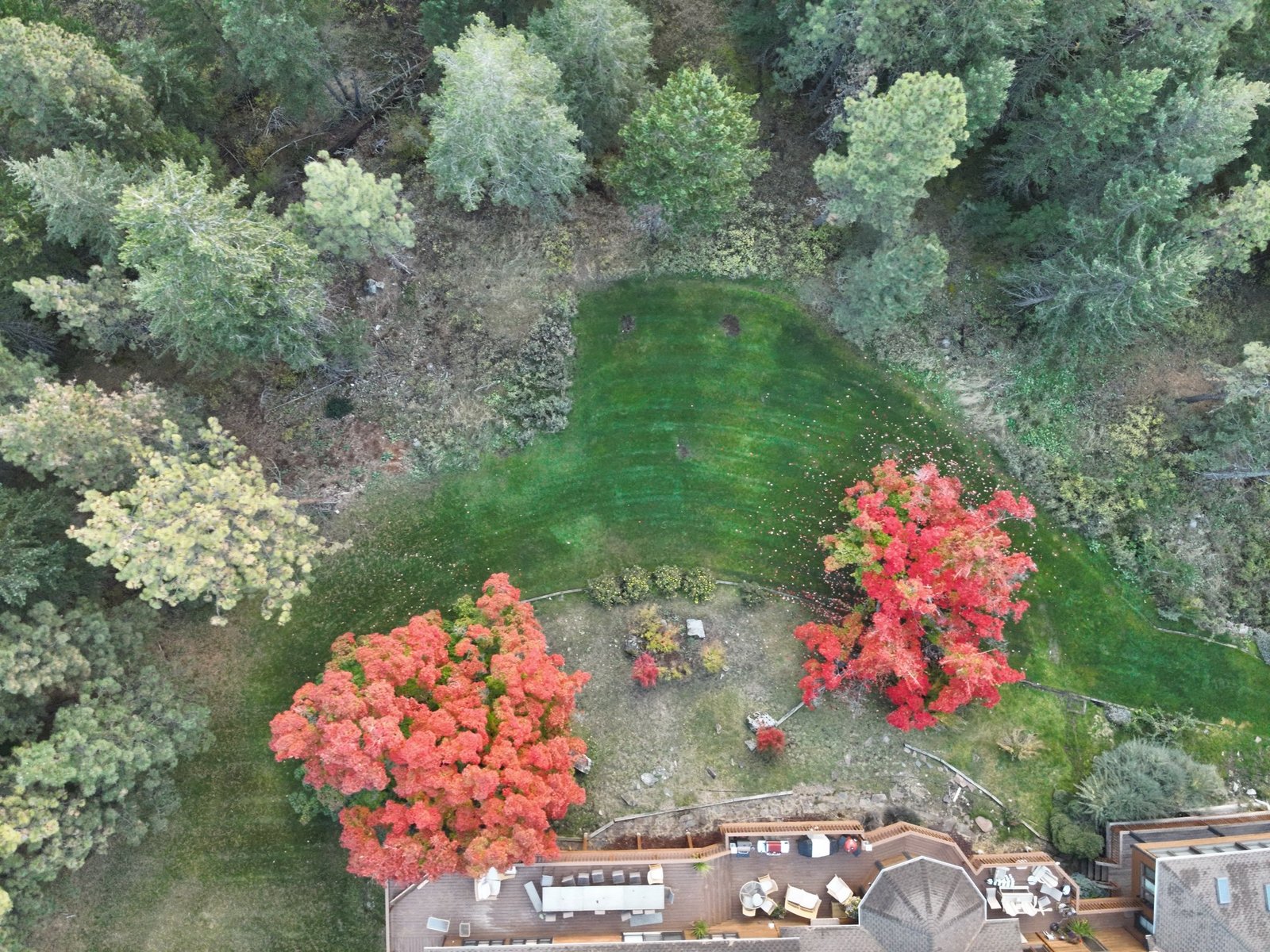 Flathead Lake autumn aerial with Eagle's Bluff peninsula and mountain backdrop