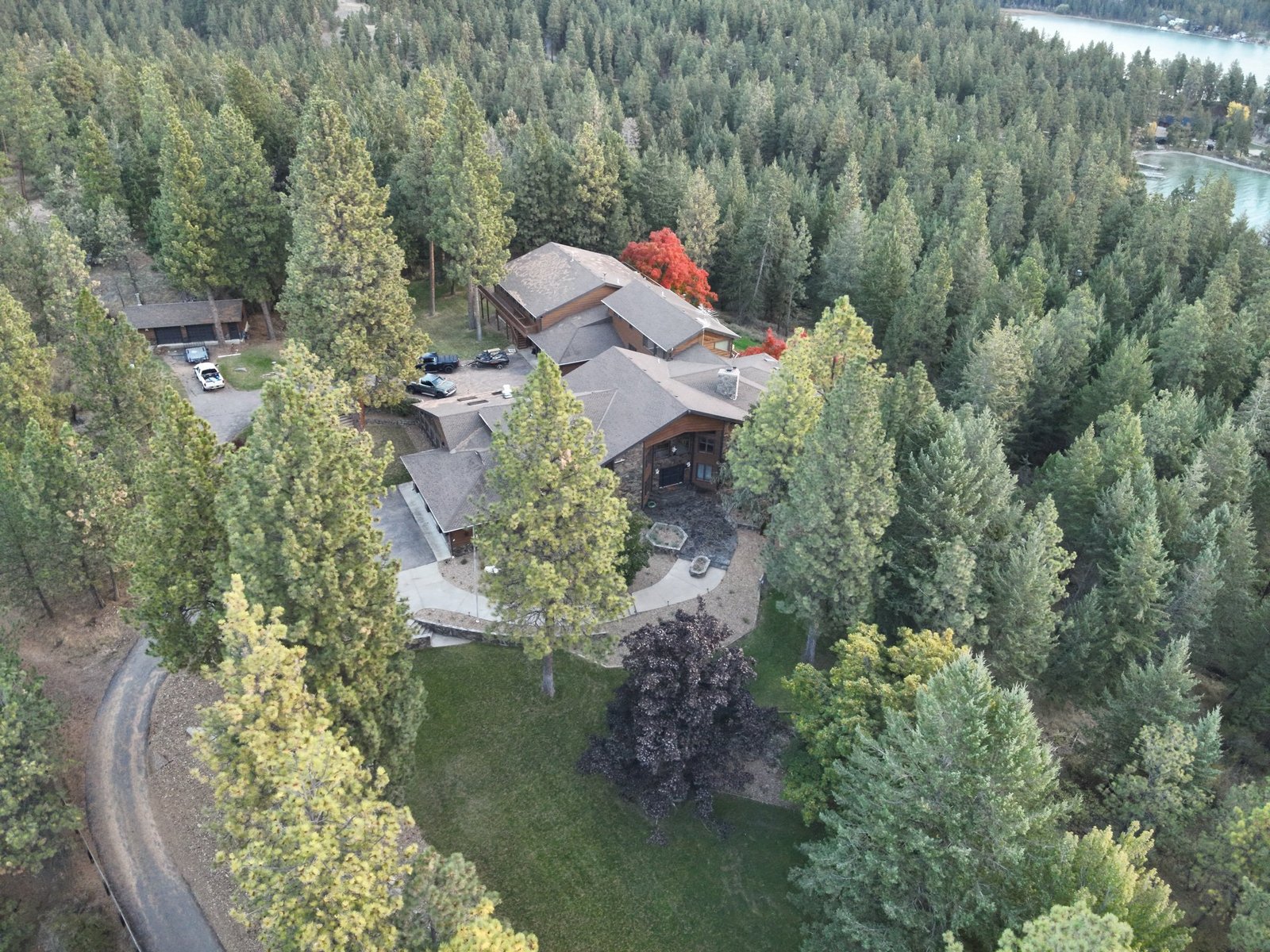 Panoramic fall view of Eagle's Bluff wedding and event venue overlooking Flathead Lake and Mission Mountains